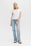Woman wearing a white t-shirt and light blue jeans on a white background