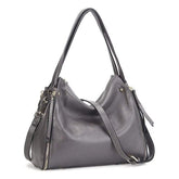 Gray handbag with a shoulder strap on a white background