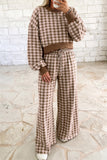 Woman in brown plaid cropped top and wide leg pants set with ribbed brown trim