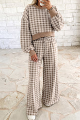 Woman in khaki plaid cropped top and wide leg drawstring pants set with ribbed trim