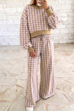 Woman in pink plaid cropped top and wide leg pants set with ribbed khaki trim