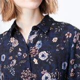 Navy floral patterned shirt worn by a person