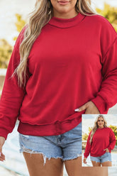 Woman wearing red crewneck sweatshirt with light blue denim shorts outdoors, with outfit inset.