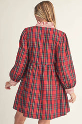 Back view of a red plaid mini dress with puff sleeves and gathered skirt