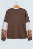 Coffee waffle knit top with cream and brown floral patchwork sleeves, back view