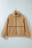 Tan sherpa fleece zip-up jacket with black contrast stitching on hanger.