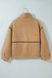 Tan sherpa fleece pullover with black contrast stitching on hanger.