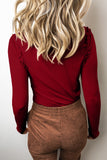 Back view of red dahlia fitted ribbed top with frill shoulder trim