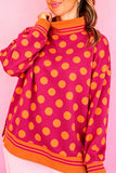 Rose polka dot mock neck sweatshirt with orange dots and striped trim, front view
