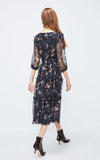 Woman wearing a floral dress on a white background