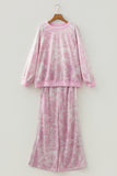 Pink abstract print sweatshirt and wide leg pants set on a hanger, front view