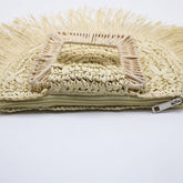 Beige woven bag with a zipper on a white background