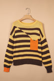 Striped knit sweater with dark brown accents and orange pocket, displayed on a hanger against beige.