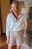White half zip top with striped fold-over collar and striped shorts, styled front view