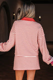 Person wearing a red and white striped dress with a blurred background