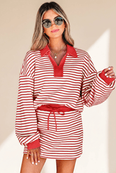 Woman wearing a red and white striped dress with a belt against a beige background