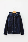 Navy blue jacket with a hood on a wooden hanger against a white background