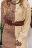 Close-up of beige-brown cable-knit sweater dress with wide brown belt and layered necklace.
