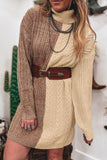 Woman in brown-cream chunky knit sweater dress with brown belt and silver necklaces.