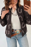 Women's brown western horseshoe print bomber jacket with bandana scarf and jeans, front view