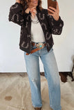 Brown horseshoe bomber jacket with concho belt and wide leg jeans, full length view