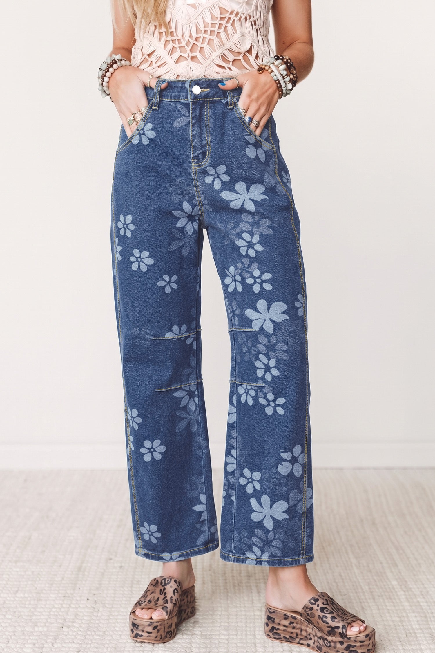 Women's blue floral print high waist ankle jeans with platform sandals, front view