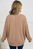 Beige ribbed tunic top with center back seam detail, back view