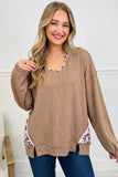 Women's beige floral trim long sleeve tunic with jeans, styled view