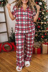 Women's plus size red plaid Christmas pajama set by the tree, front view