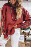 Women's mineral red checkered trim oversized sweatshirt with white jeans, front view
