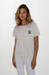Woman wearing a light gray t-shirt with a logo on a white background