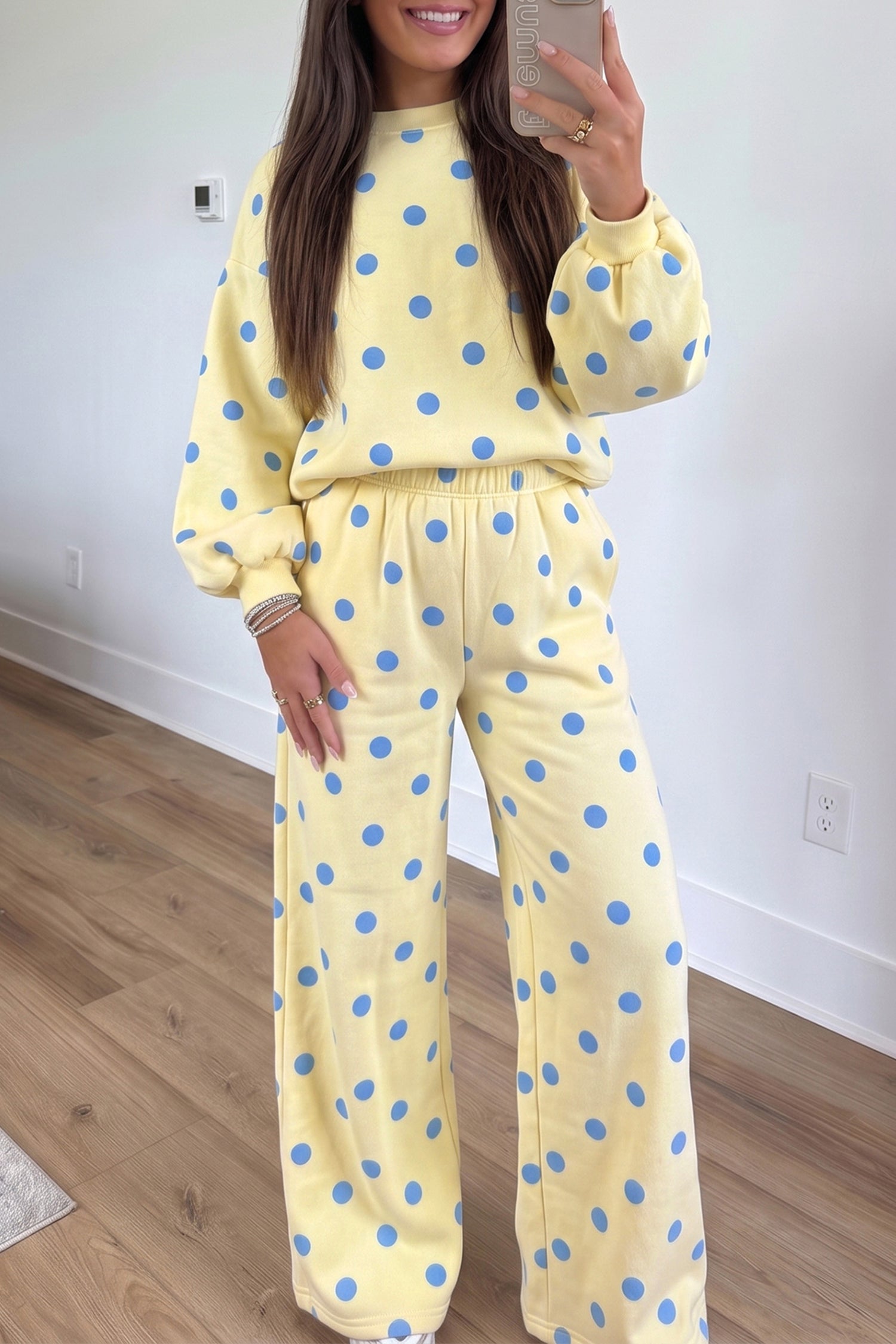 Yellow sweatshirt and wide leg pants set with blue polka dots and puff sleeves, front view