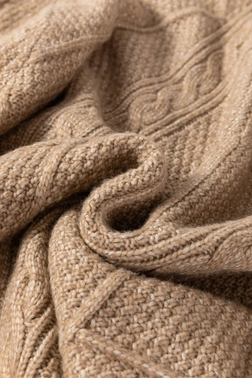 Close-up of a textured beige fabric with intricate patterns