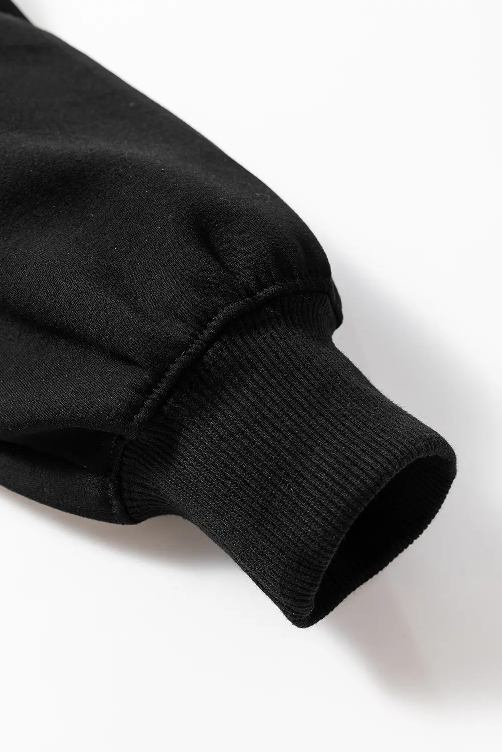 Close-up of a black sleeve on a white background
