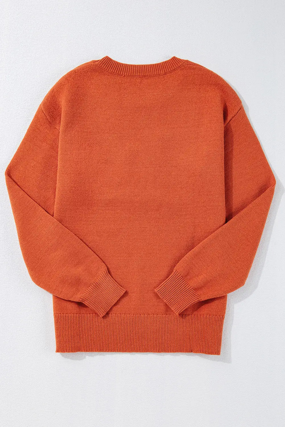 Orange sweater on a white background