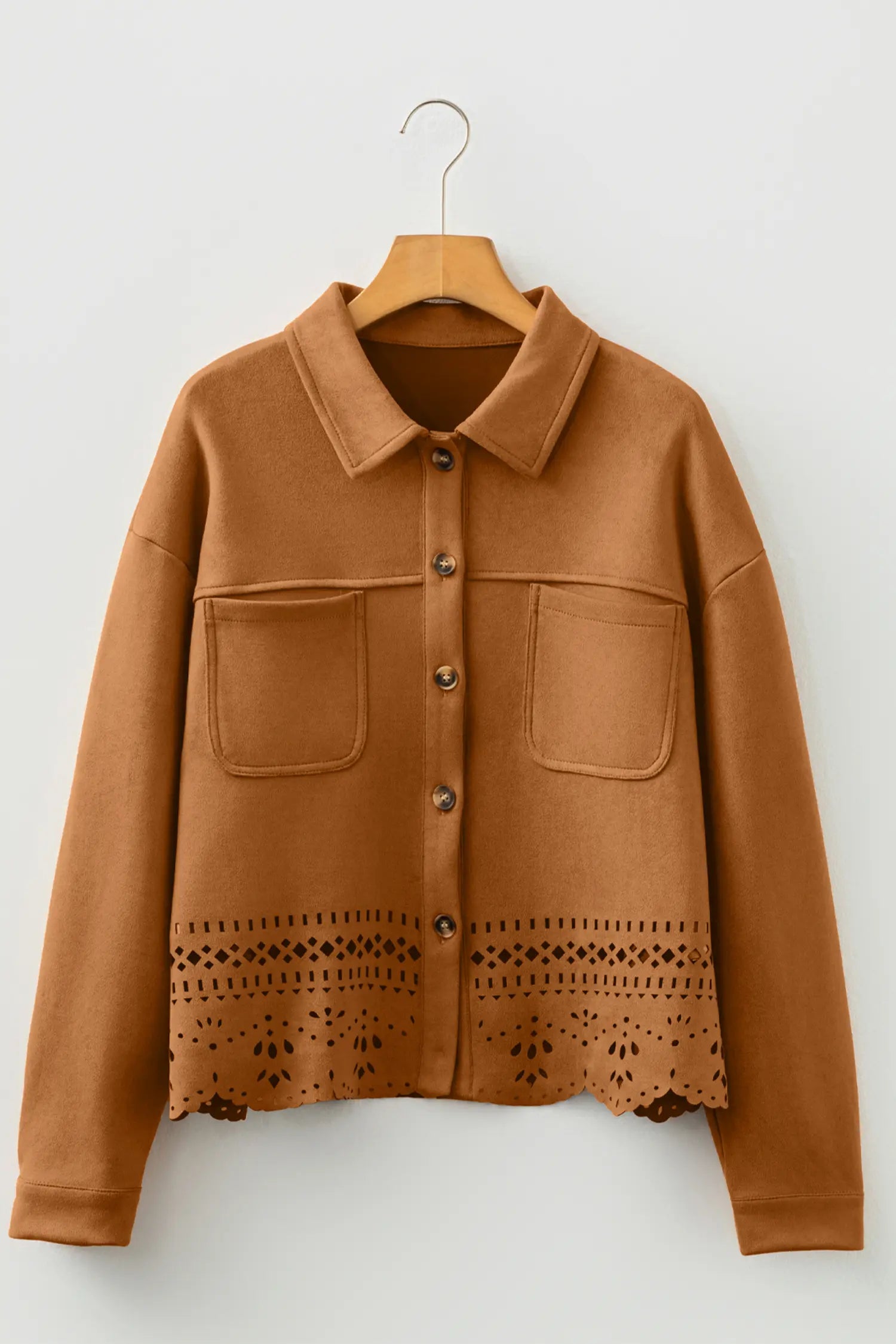 Brown jacket with lace detailing on a hanger against a white background