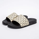 Black slides with gold pattern on a white background