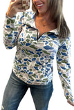 Woman wearing a patterned long-sleeve shirt and jeans on a white background