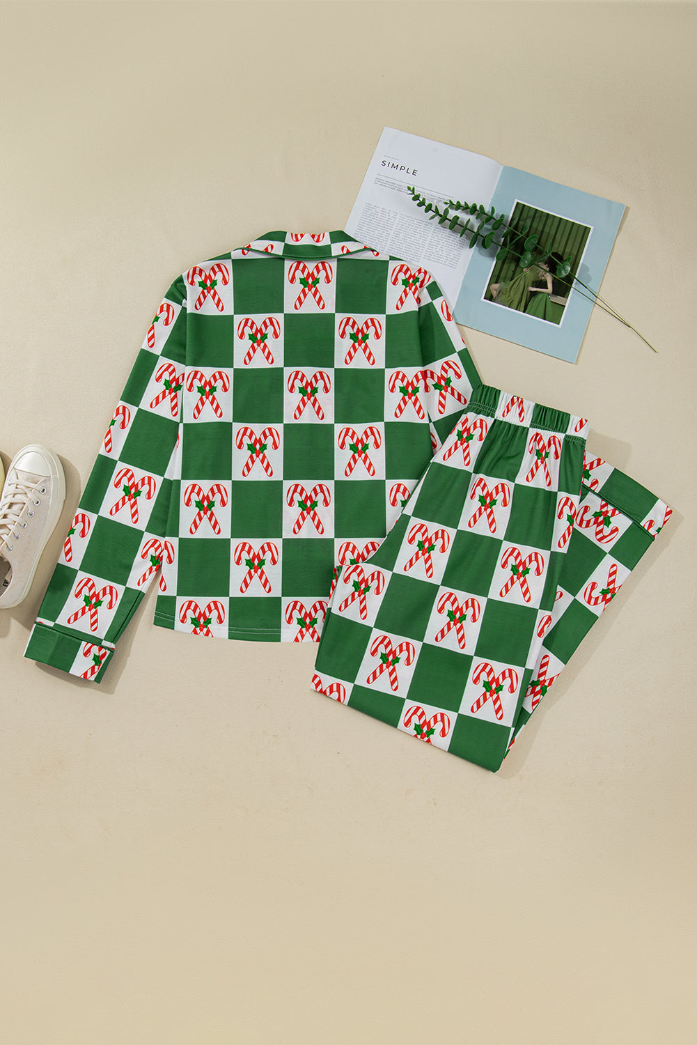Green and red checkered fabric with candy cane pattern on a beige surface.