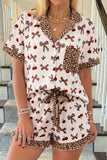 Woman wearing a patterned outfit with bows and leopard print details.
