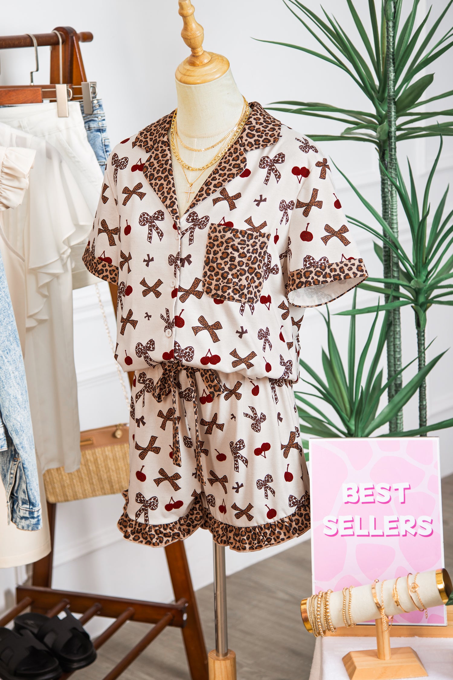 Leopard print pajama set on a mannequin with 'Best Sellers' sign in a store setting.