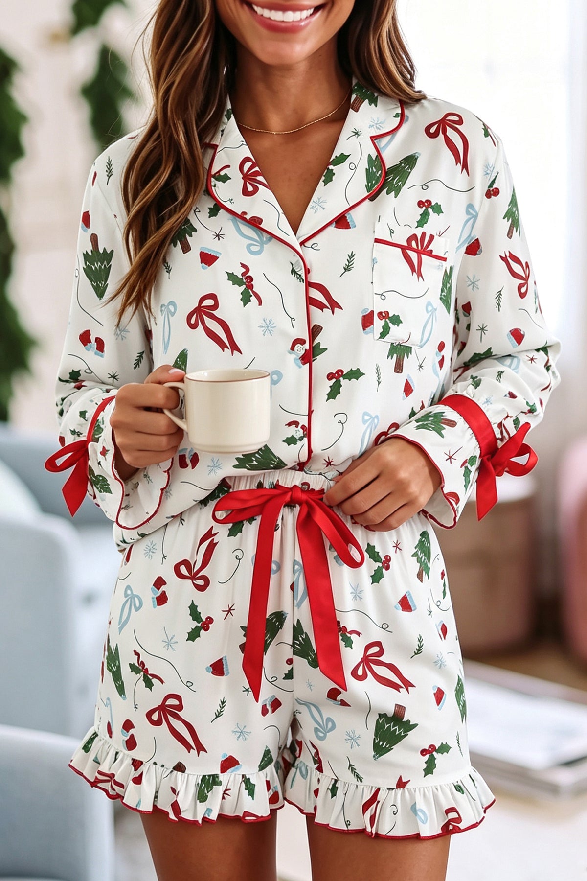 Woman in white Christmas-print pajama set with ruffled shorts and mug.