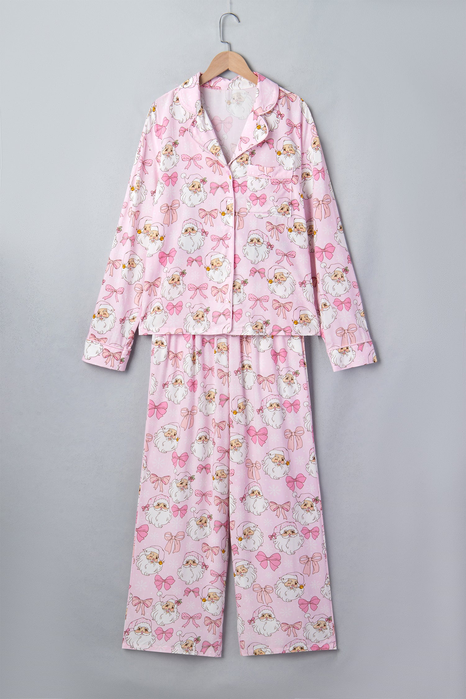 Light pink pajama set with white cats, pink bows, and gold collars.