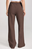 Brown wide-leg pants worn by a person on a white background
