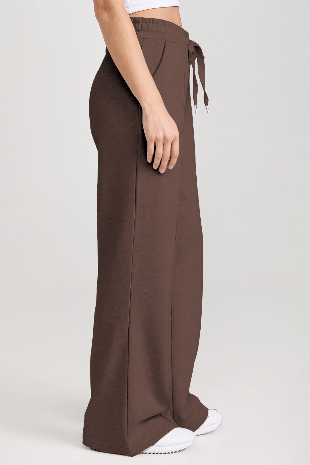 Brown wide-leg pants with a tie waist on a white background