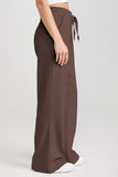 Brown wide-leg pants with a tie waist on a white background