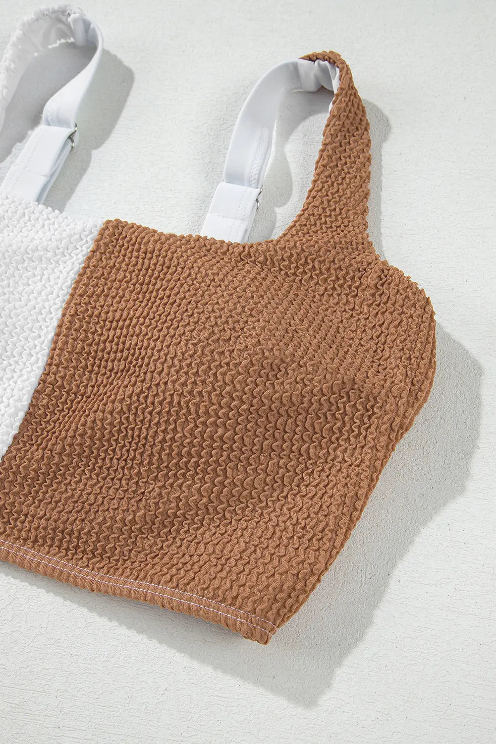 Brown knitted bag on a white background