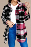 Person wearing a plaid shirt with pink, black, and white pattern over a white top and blue jeans on a beige background.