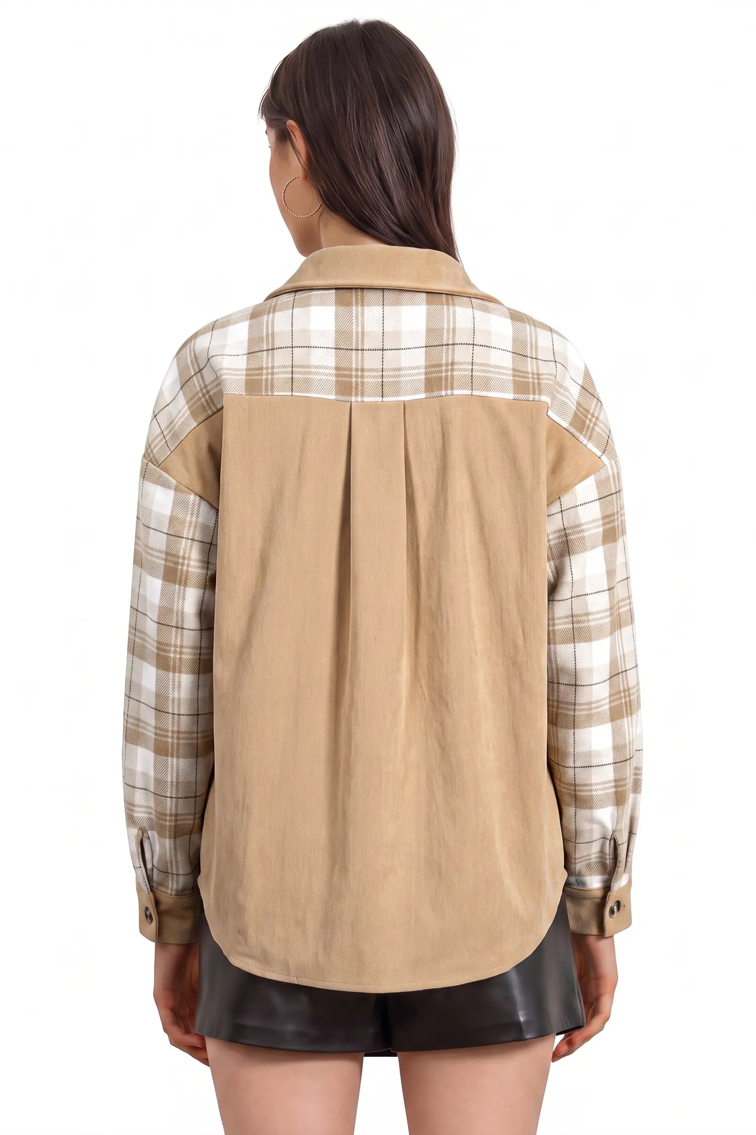 A woman viewed from the back wearing a long-sleeve button-up shirt with a tan corduroy back panel and beige-and-white plaid sleeves and yoke, paired with black shorts against a plain white background.