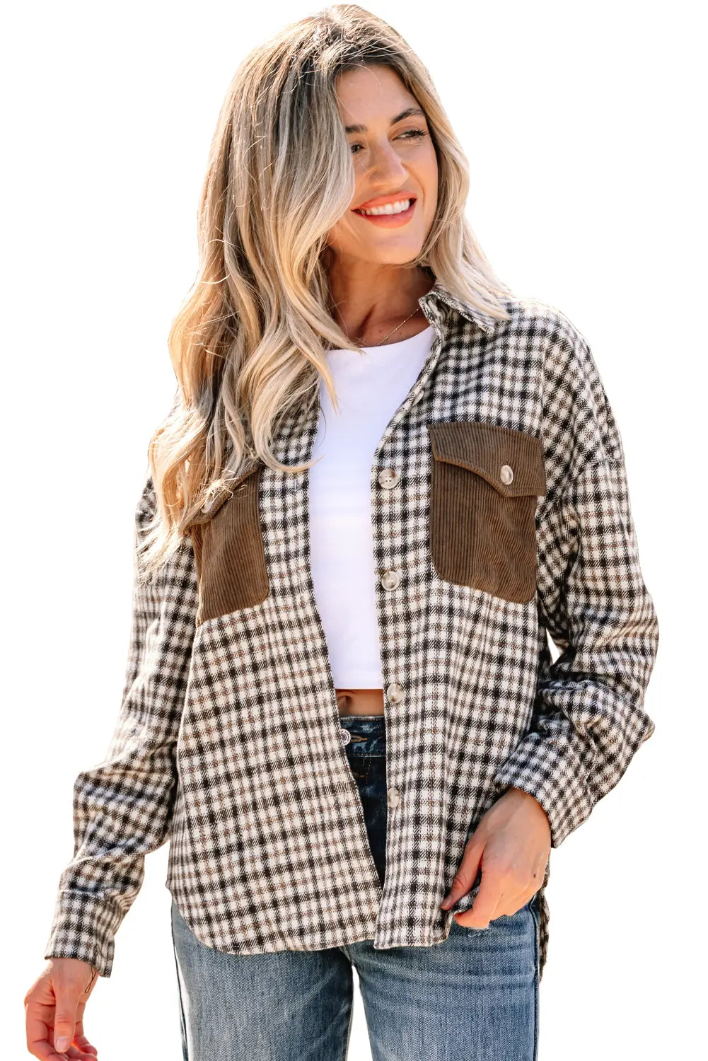 Woman wearing a plaid shirt with brown pocket flaps on a white background
